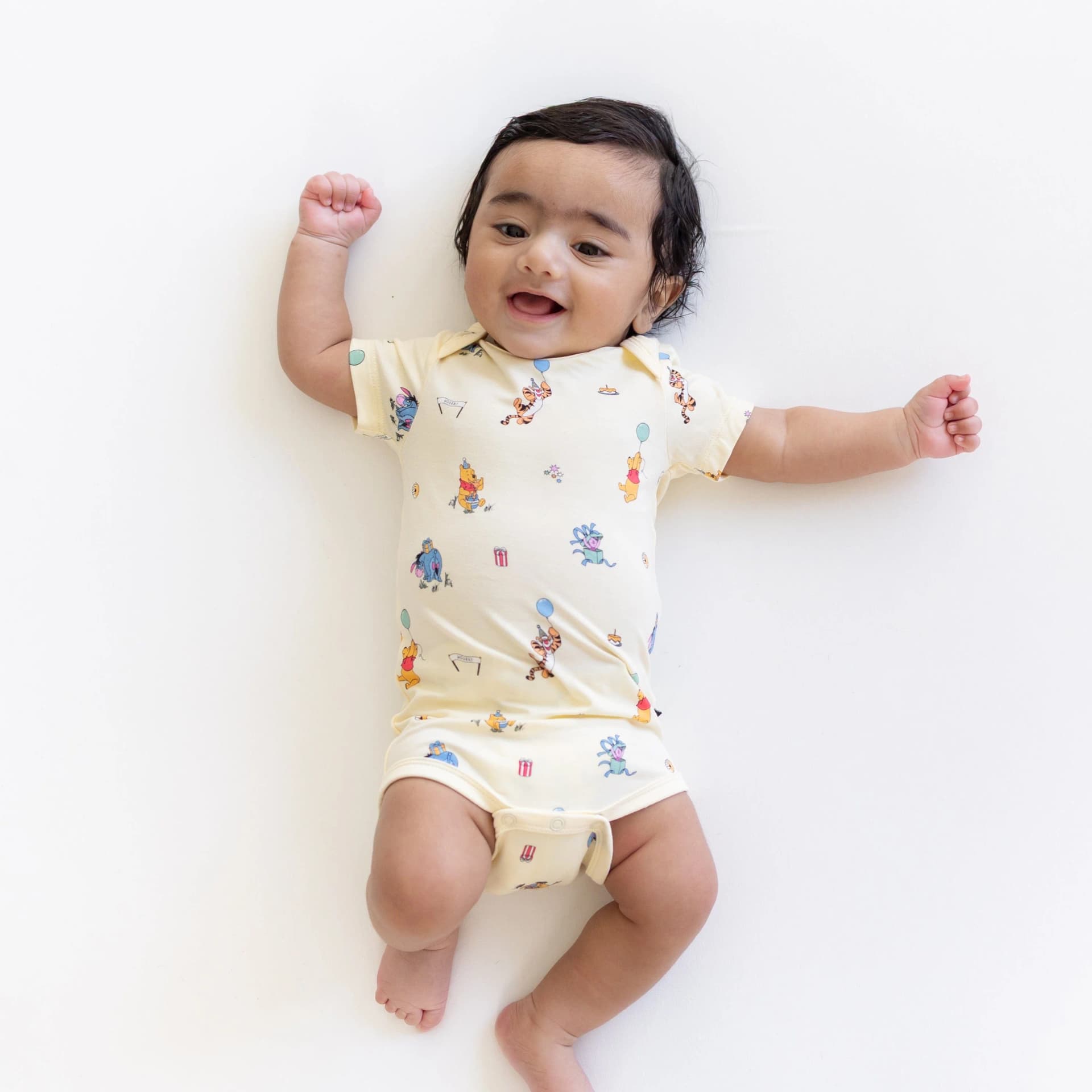 Bodysuit in Winnie the Pooh Celebration by Kyte Baby