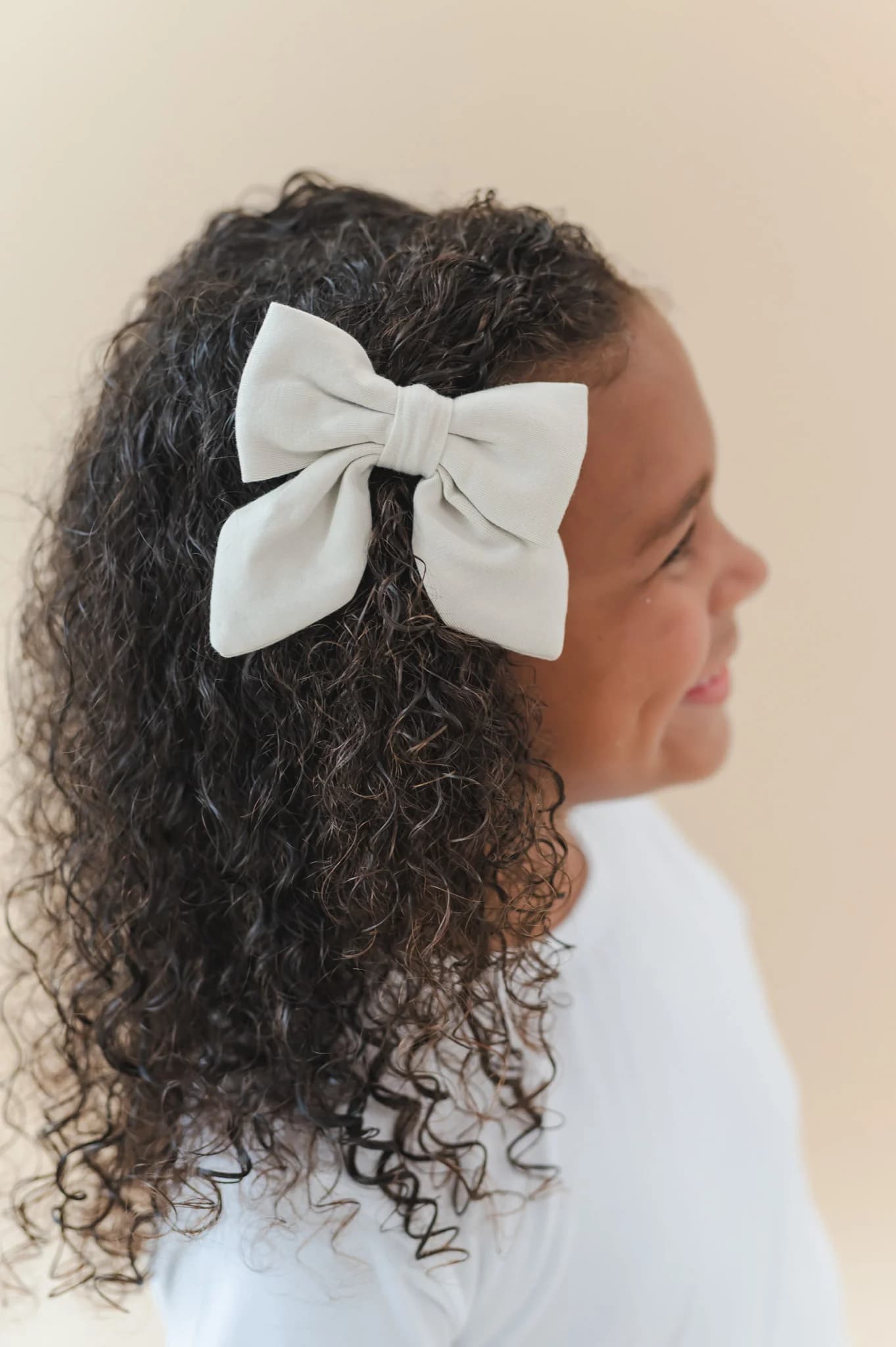 Large Alligator Clip Bow in Oat by Kyte Baby