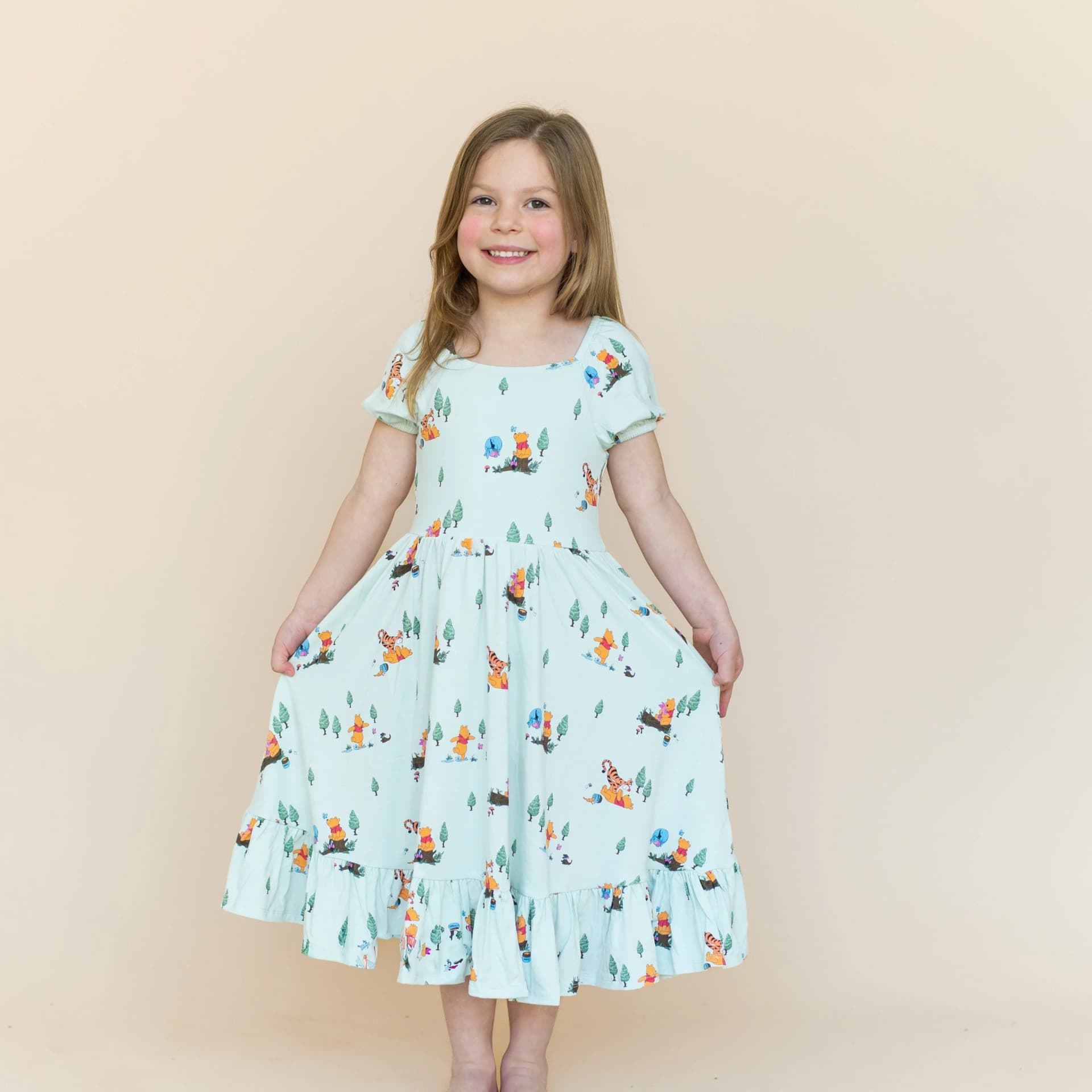 Puff Sleeve Twirl Dress in Winnie the Pooh Hundred Acre Wood by Kyte Baby