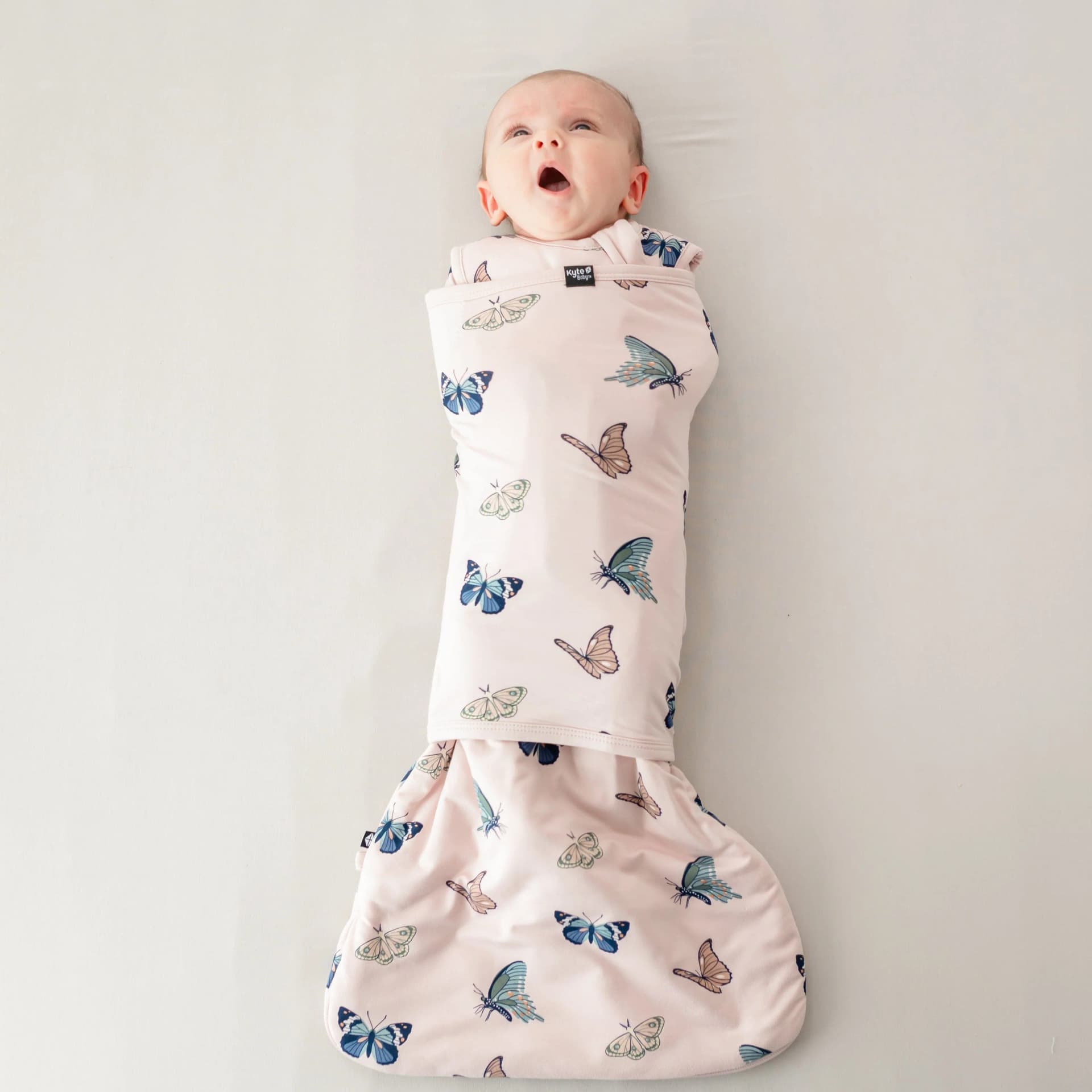 Sleep Bag Swaddler in Blush Butterfly 1.0 by Kyte Baby