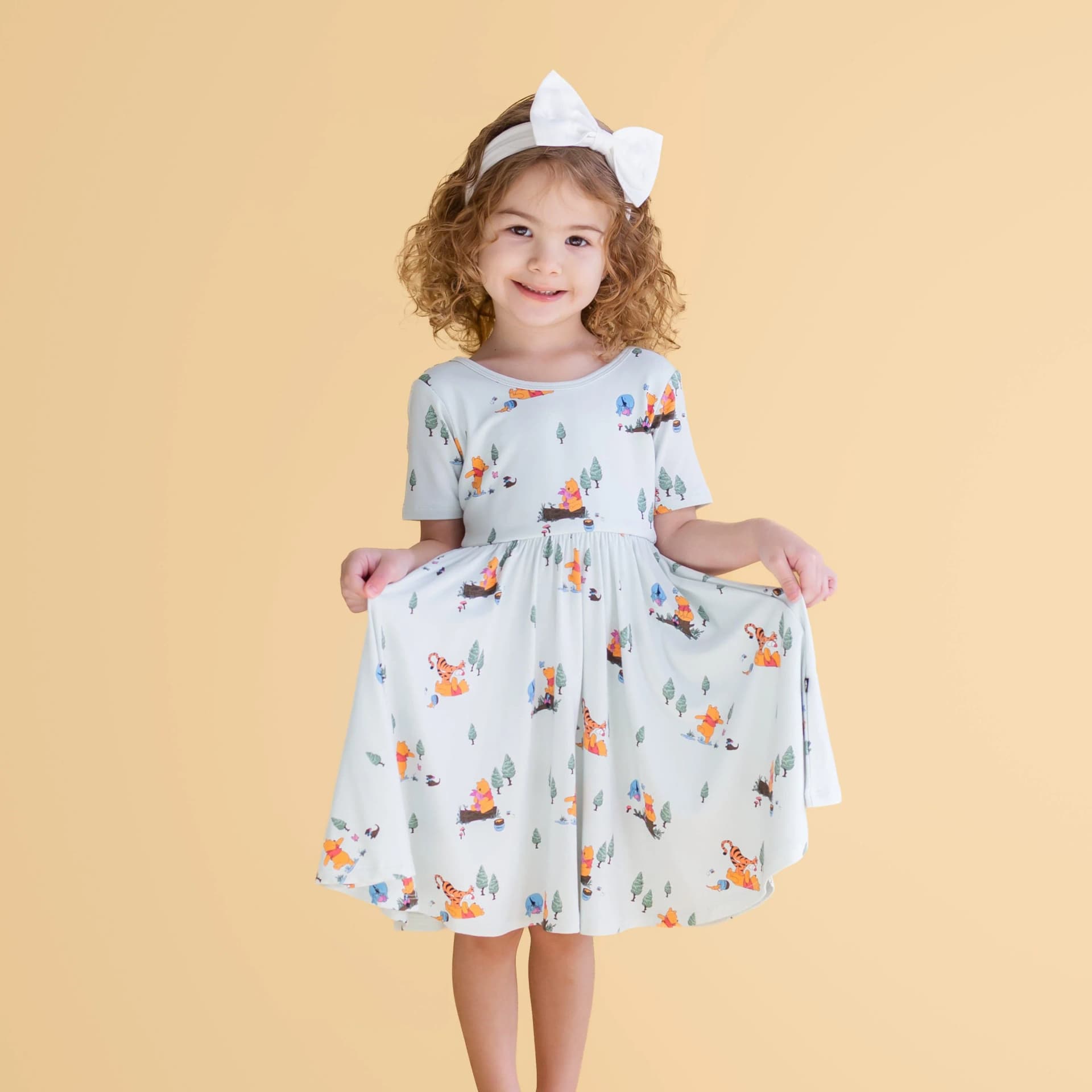 Twirl Dress in Winnie the Pooh Hundred Acre Wood by Kyte Baby