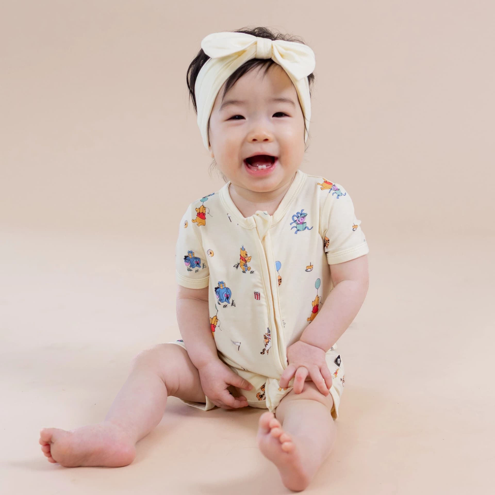 Zipper Shortall Romper in Winnie the Pooh Celebration by Kyte Baby