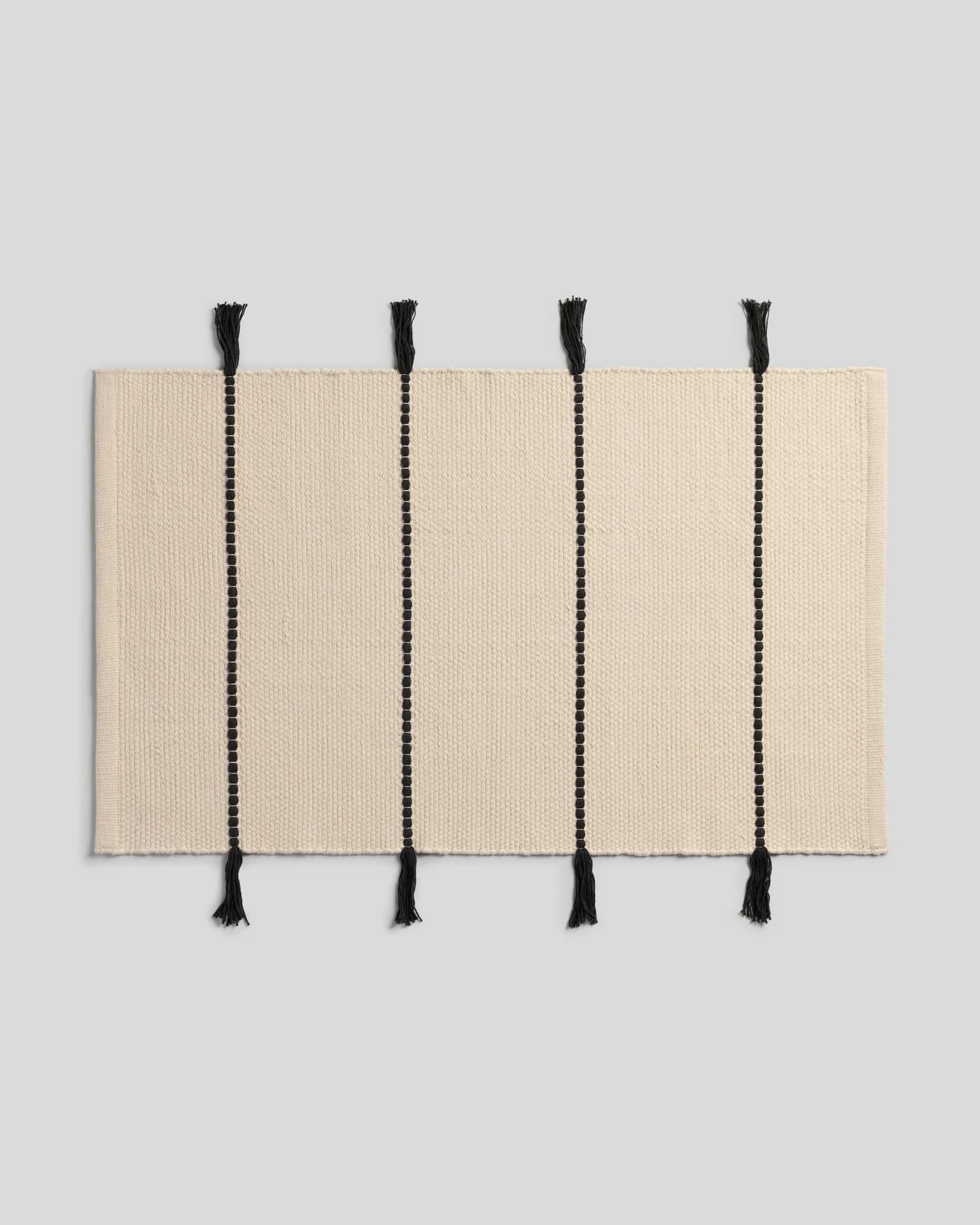 Organic Tassel Bath Rug (Natural and Onyx) by Parachute Home